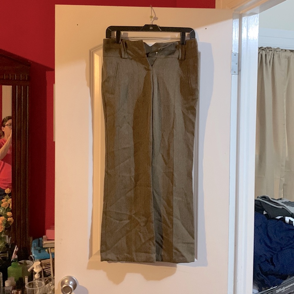 brown slacks. I’m too big for them. Hemmed at the bottom for short legs